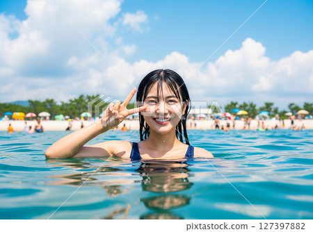 Women playing in the sea 127397882
