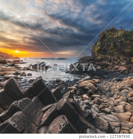 Panorama of volcanic basalt columns Ganh Da Dia on beach by the sea. Landscape with Da Dia reef in Vietnam at sunrise Panorama of volcanic basalt columns Ganh Da Dia on beach by the sea. Landscape with Da Dia reef in Vietnam at sunrise 127397930