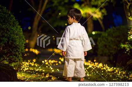 A boy and a shining path leading to a forest 127398213