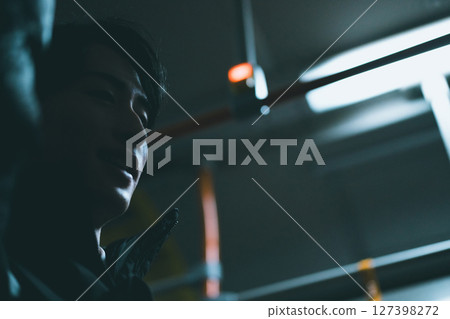 A man returning home by bus 127398272