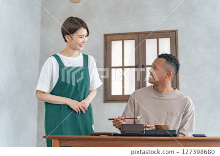 Restaurant staff serving black men Restaurant staff serving black men 127398680