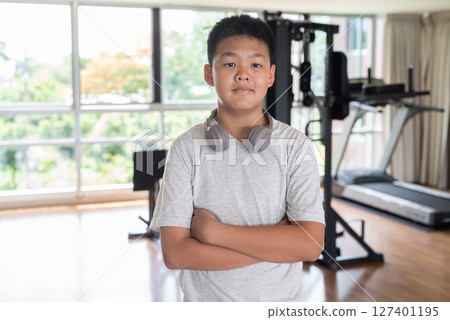 Young Teen Boy Working Out in Gym Portrait 127401195