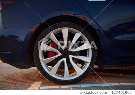 Close up side view of the rear wheel of the modern car 127401903