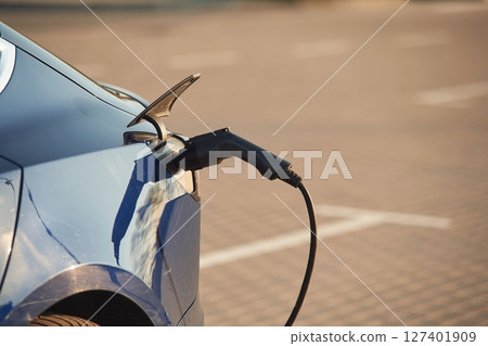 Close up view of the modern electric car that is charging 127401909
