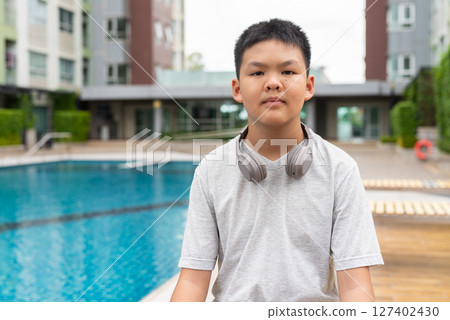 Teenage Boy at Poolside During Summer Teenage Boy at Poolside During Summer 127402430