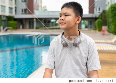 Teenage Boy at Poolside During Summer Teenage Boy at Poolside During Summer 127402431