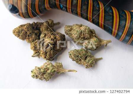 Marijuana Cannabis weed buds with pipe and grinder. 127402794