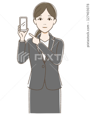 A woman in a suit pointing at her smartphone 127403078
