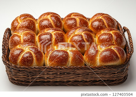 Romantic baked buns. Variety of baked buns in on a wooden trading tray on a white background. 127403504