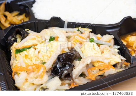 Delicious Chinese bento with fried pork and vegetables 127403828