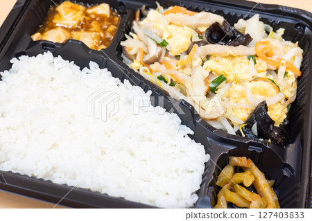 Delicious Chinese bento with fried pork and vegetables 127403833