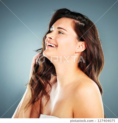 Beauty, skincare and hair with woman and smile for facial, product and spa luxury. Self love, happy and hair care with face of girl model for cosmetics, makeup and salon in studio background 127404075