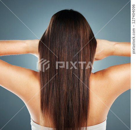 Beauty, salon and wellness model with straight hair texture from smooth, healthy and brazilian keratin shampoo. Cosmetic, shine and beautiful hair care woman in gray studio with back view. Beauty, salon and wellness model with straight hair texture from smooth, healthy and brazilian keratin shampoo. Cosmetic, shine and beautiful hair care woman in gray studio with back view. 127404096