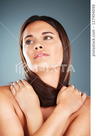 Hair, beauty and natural model with thinking face holding smooth, shiny and salon cosmetic texture. Health, skincare and hair care woman contemplating aesthetic in gray gradient studio. 127404098