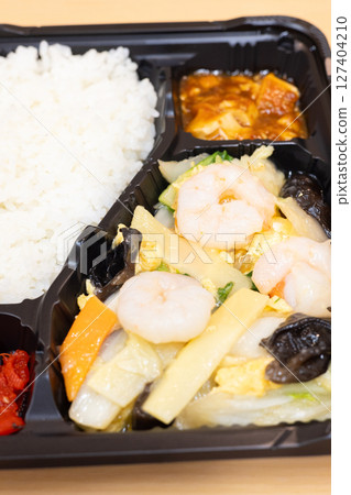 Delicious Chinese bento with fried shrimp and vegetables 127404210