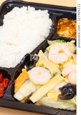 Delicious Chinese bento with fried shrimp and vegetables Delicious Chinese bento with fried shrimp and vegetables 127404212