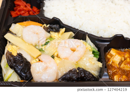 Delicious Chinese bento with fried shrimp and vegetables Delicious Chinese bento with fried shrimp and vegetables 127404219