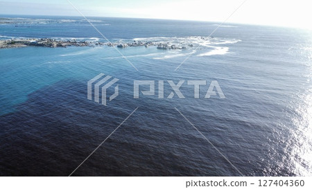 Aerial Abstraction of Foamy Turquoise Ocean Currents 127404360