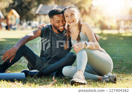 Couple, fitness and sitting on grass, park or lawn together in sunshine for fitness, wellness and health. Interracial relationship diversity or black man with woman, relax or rest at outdoor training Couple, fitness and sitting on grass, park or lawn together in sunshine for fitness, wellness and health. Interracial relationship diversity or black man with woman, relax or rest at outdoor training 127404362