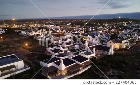 Twilight Illumination Over Coastal Village Twilight Illumination Over Coastal Village 127404363