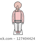 Woman measuring posture from behind 127404424
