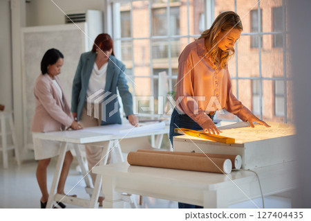 Architect, blueprint paper and reading building design, floor plan and planning creative architecture project in startup company. Engineer expert, document and strategy while working in engineering Architect, blueprint paper and reading building design, floor plan and planning creative architecture project in startup company. Engineer expert, document and strategy while working in engineering 127404435