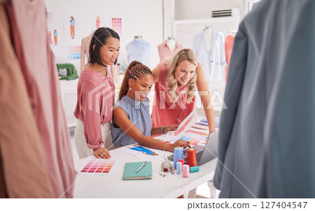 Creative, fashion and designer team on laptop in office for planning, thinking and brainstorm, strategy and innovation. Business women, fashion designers and online for vision, ecommerce and startup 127404547