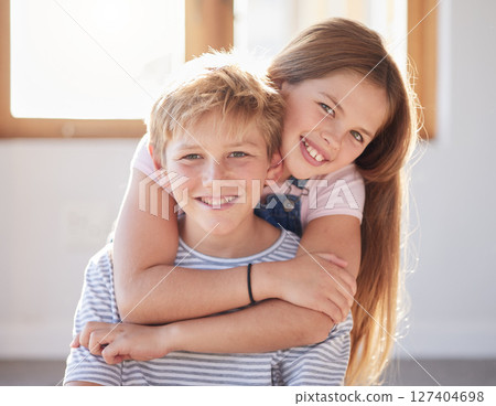 Family, hug and portrait of girl an boy in a living room, bonding and happy while enjoying quality time together. Face, happy family and sibling brother and sister embrace, playful and relax at home 127404698