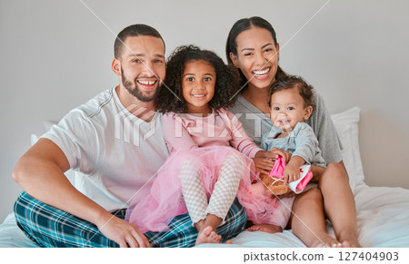 Family, portrait and bedroom relax for bonding, love and care with girl children on the home bed. Mother, father and sisters or siblings bond with parents in loving relationship in childhood Family, portrait and bedroom relax for bonding, love and care with girl children on the home bed. Mother, father and sisters or siblings bond with parents in loving relationship in childhood 127404903