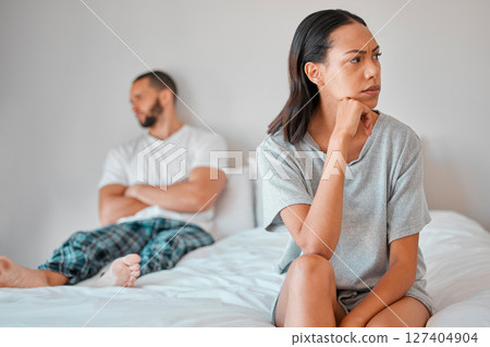 Couple, fight or divorce for angry woman on bed in house, home or hotel bedroom in cheating affair, scandal or argument. Frustrated, mad or annoyed wife and man in stress, burnout or marriage crisis 127404904