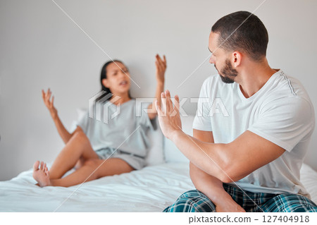 Argument, stress and couple fighting in bed for breakup, divorce or toxic relationship at home. Break up, angry and upset man and woman arguing in bedroom for cheating, affair or financial difficulty 127404918