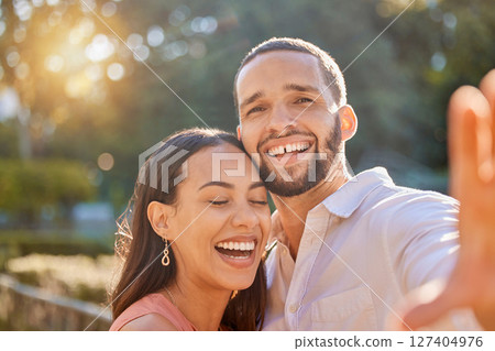 Couple, funny selfie and happiness while outdoor in summer on vacation for love, care and memory or profile picture for social media. Portrait of a happy man and woman in nature for a romantic date Couple, funny selfie and happiness while outdoor in summer on vacation for love, care and memory or profile picture for social media. Portrait of a happy man and woman in nature for a romantic date 127404976