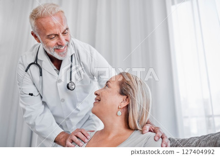 Support, healthcare and doctor with woman in home for checkup, health exam or test. Consultation, wellness and mature patient consulting medical worker on sofa in living room with trust and empathy. Support, healthcare and doctor with woman in home for checkup, health exam or test. Consultation, wellness and mature patient consulting medical worker on sofa in living room with trust and empathy. 127404992