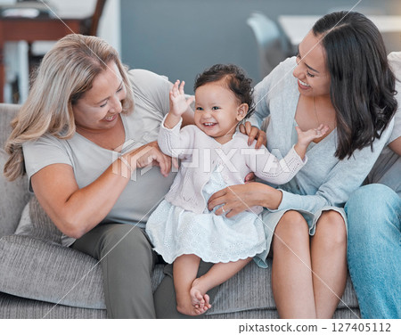 Family home, love and baby, mother and grandmother with happiness on living room couch for love, care and fun while excited, happy and dancing. Generation of women on the sofa for support and pride Family home, love and baby, mother and grandmother with happiness on living room couch for love, care and fun while excited, happy and dancing. Generation of women on the sofa for support and pride 127405112