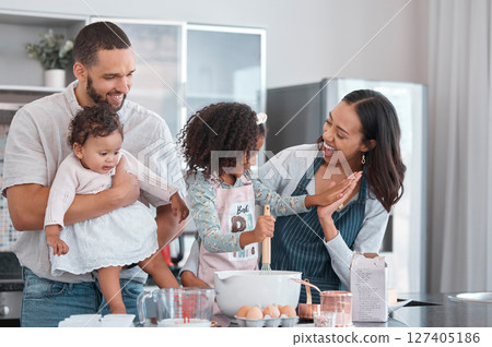 Family, baking and cooking together with high five in home kitchen with children learning from mother and father to cook food, breakfast and pancakes or cake. Man, woman and kids helping make cookies Family, baking and cooking together with high five in home kitchen with children learning from mother and father to cook food, breakfast and pancakes or cake. Man, woman and kids helping make cookies 127405186