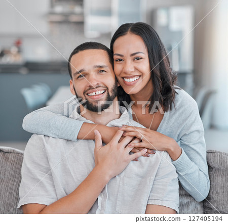 Couple, hug and portrait of a man and woman embracing for love, care and affection at home. Husband, wife and caring, romantic relationship while hugging with happiness on the living room sofa Couple, hug and portrait of a man and woman embracing for love, care and affection at home. Husband, wife and caring, romantic relationship while hugging with happiness on the living room sofa 127405194