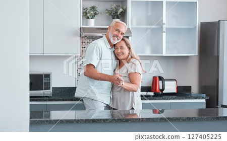 Love, marriage and dance with a senior couple in the kitchen of their home together for bonding or romance. Portrait, happy and smile with a mature man and woman romantic dancing in their house Love, marriage and dance with a senior couple in the kitchen of their home together for bonding or romance. Portrait, happy and smile with a mature man and woman romantic dancing in their house 127405225