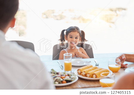 Child, girl or family lunch meal at dining table for holiday celebration, reunion or social gathering. Portrait, smile or happy kid with healthy food in house, home or restaurant and bonding at party Child, girl or family lunch meal at dining table for holiday celebration, reunion or social gathering. Portrait, smile or happy kid with healthy food in house, home or restaurant and bonding at party 127405315