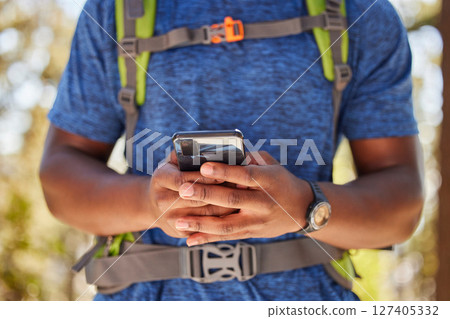 Hiking, hands and phone of backpacker browsing 5g gps directions in nature for fitness and exercise adventure. Cellphone, hiker and freedom online for backpacking explore in a natural environment 127405332