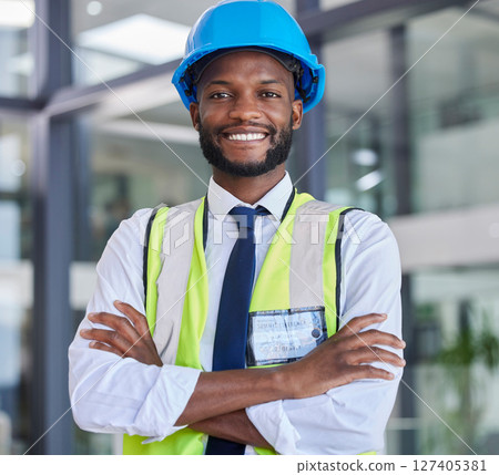 Portrait, construction and engineer man or construction worker with arms crossed in industrial startup office. Architecture, builder and industry with a male business owner in architect company 127405381