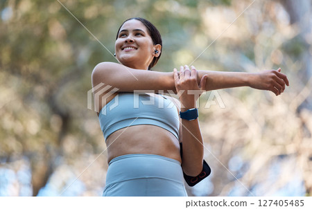Fitness, healthcare and woman stretching arm getting ready for training, exercise or workout. Sports, wellness and happy female runner warm up alone outdoors preparing for running, jog or marathon. Fitness, healthcare and woman stretching arm getting ready for training, exercise or workout. Sports, wellness and happy female runner warm up alone outdoors preparing for running, jog or marathon. 127405485