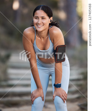 Fitness, tired or black woman runner with phone taking break from running training, exercise or nature workout. Athlete, health motivation or girl relax in park exhausted, fatigue or recover energy 127405488