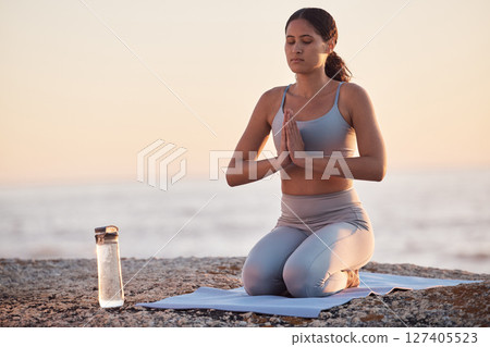 Meditation, beach yoga and zen woman training, workout and meditate for soul, aura or chakra energy healing. Mindfulness exercise, freedom and fitness yogi with healthy mindset, peace and wellness 127405523