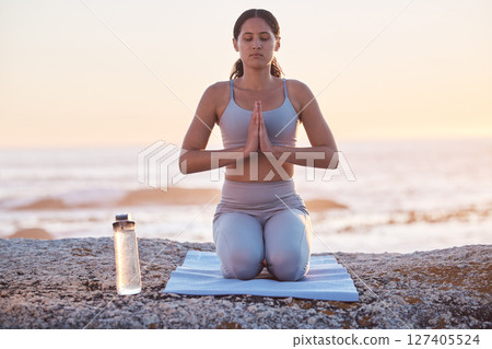 Gen z woman, yoga and beach meditation, zen and fitness training, spiritual and prayer outdoor during sunset in nature. Calm female, mindfulness and healthy mindset for wellness at ocean in Hawaii Gen z woman, yoga and beach meditation, zen and fitness training, spiritual and prayer outdoor during sunset in nature. Calm female, mindfulness and healthy mindset for wellness at ocean in Hawaii 127405524