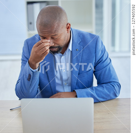 Businessman, laptop and headache in burnout, stress or depression from overworking at the office. Black man employee suffering in mental health problems or strained eyes from long hours on computer Businessman, laptop and headache in burnout, stress or depression from overworking at the office. Black man employee suffering in mental health problems or strained eyes from long hours on computer 127405592