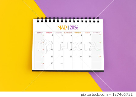 March 2026 Monthly desk calendar for 2026 year on yellow and purple color background. March 2026 Monthly desk calendar for 2026 year on yellow and purple color background. 127405731