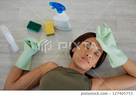 Burnout, housework and woman sleeping on floor while doing chores with rubber gloves and detergent. Sleep, house work and tired mother asleep on ground, exhausted while busy cleaning and washing home 127405753