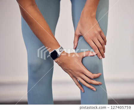 Fitness, sports and injury, woman with knee pain at gym workout. Exercise, pain and girl with hand on leg for muscle massage, physical therapy for sports injury on knee and accident while training. 127405759