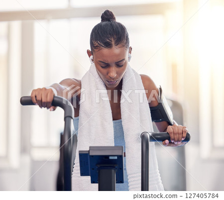 Stationary, bike and fitness black woman in gym for exercise challenge, workout motivation and goal with speed, fast and heart algorithm technology. Cycling machine, sports and Crossfit training girl Stationary, bike and fitness black woman in gym for exercise challenge, workout motivation and goal with speed, fast and heart algorithm technology. Cycling machine, sports and Crossfit training girl 127405784