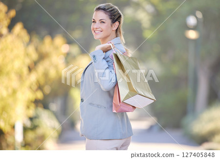 Shopping, portrait and woman customer happy with retail sales, discount and promotion stock walking in park or outdoor in summer. Shopping bag, gift or present girl with wealth, rich and luxury life Shopping, portrait and woman customer happy with retail sales, discount and promotion stock walking in park or outdoor in summer. Shopping bag, gift or present girl with wealth, rich and luxury life 127405848